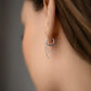 Single 9 mm huggies earring with 2 chains.